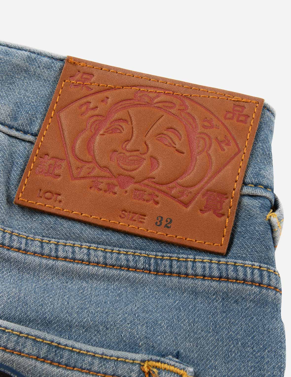 家花印花口袋休闲宽版牛仔裤