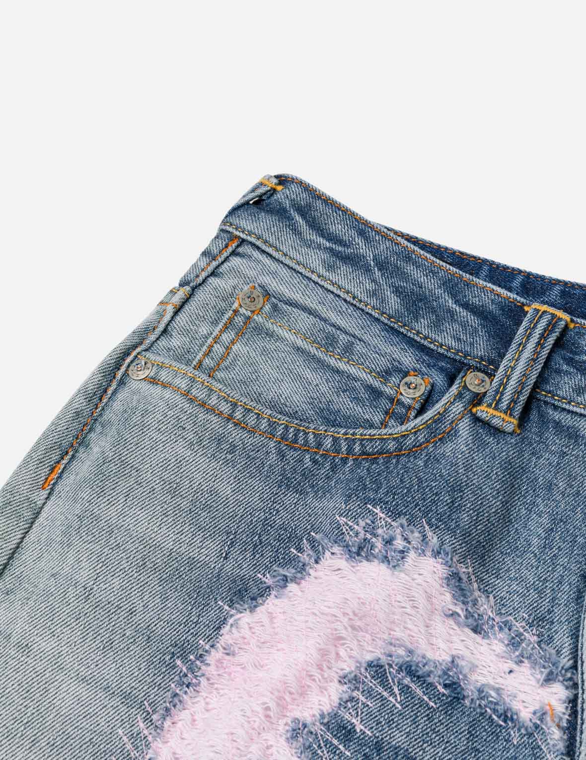 做旧大 M 弯刀牛仔裤